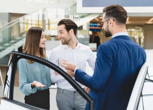 car-test-drive-concept-shop-assistant-helping-fam-2021-12-09-11-50-31-utc