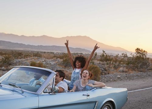 group-of-friends-on-road-trip-driving-classic-conv-2021-08-26-16-15-07-utc